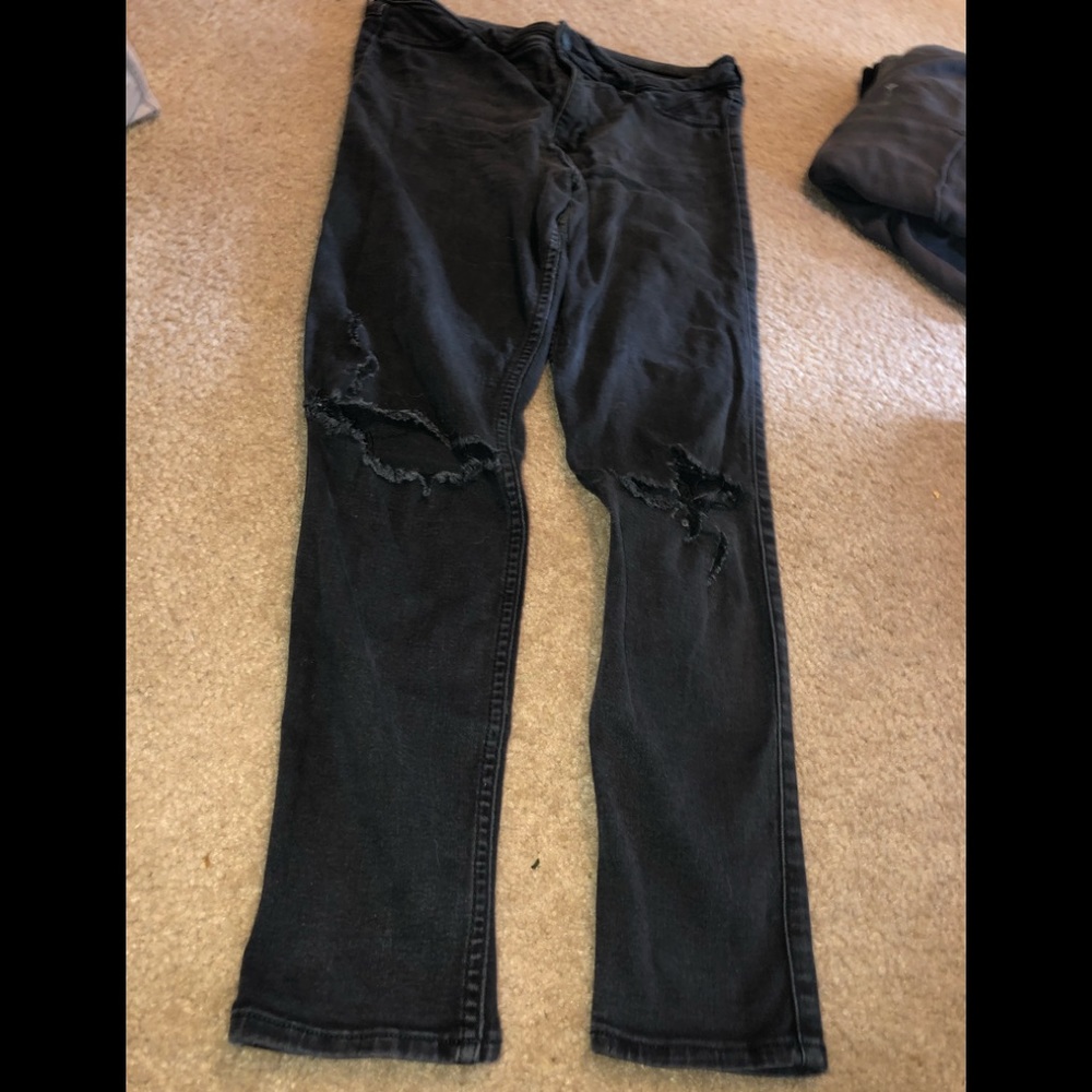 Blackish grey ripped knee jeans